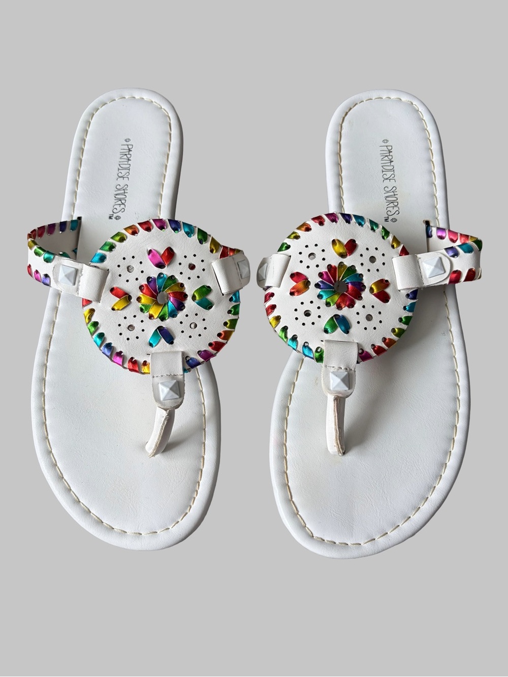 White Thong Sandal with Round Rainbow Metallic Medalion Cutout Design